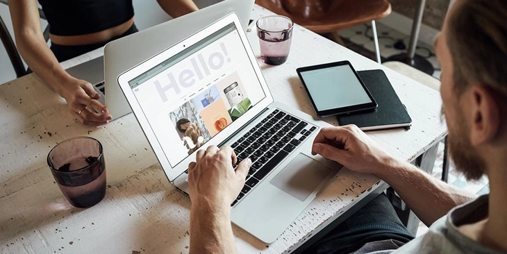 person checking theme on laptop